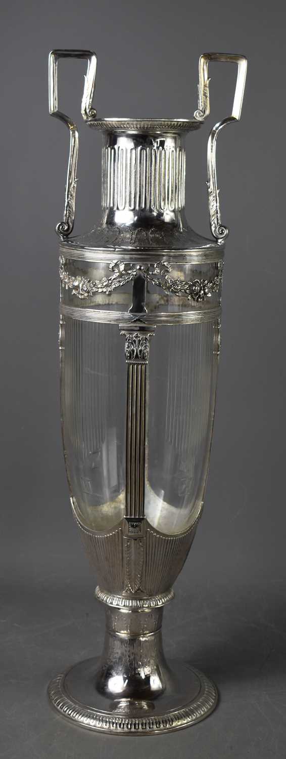 A large Art Nouveau silver plated German Orvit urn form vase, the twin handles above reeded glass