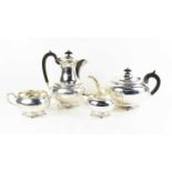 A silver tea service comprising tea pot, hot water pot, milk jug and sugar bowl, Sheffield 1936,