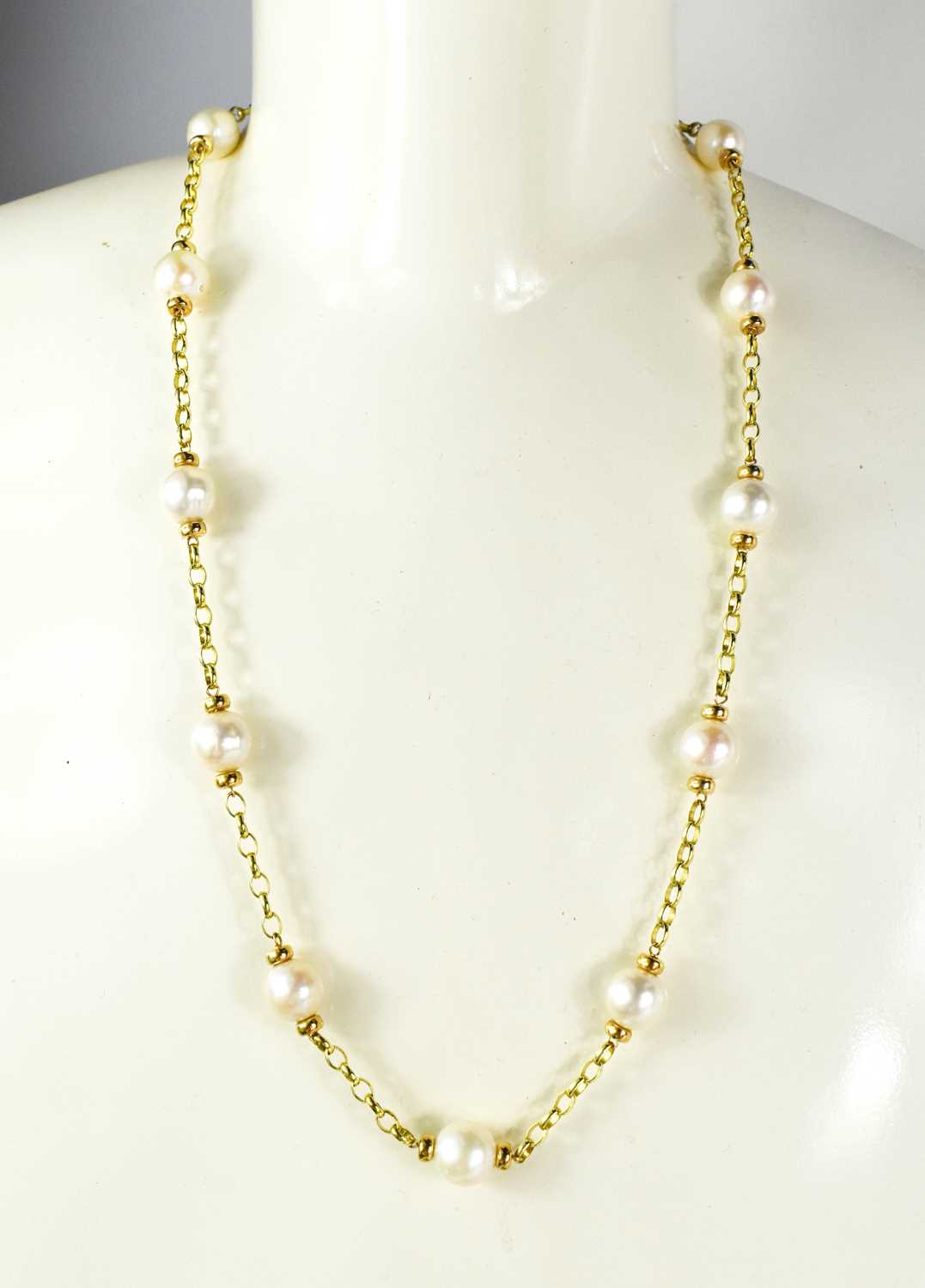 A 9ct gold and pearl necklace, each pearl united by chain form links, 33g. - Image 2 of 2