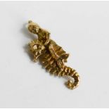 A 9ct gold charm of a mermaid riding a seahorse, 2.3g.