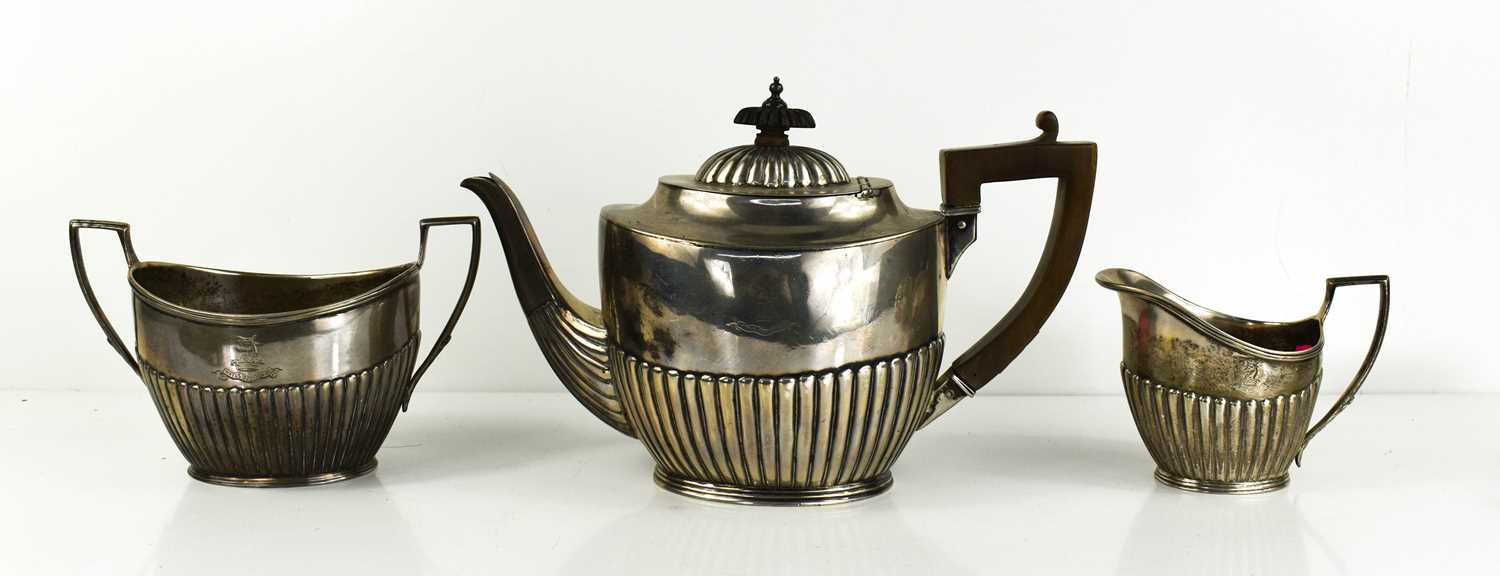 An Art Deco, Grish Chunder Dutt, Indian silver tea set, with gadroon decoration, comprising tea
