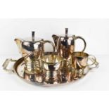 An Art Deco silver plated tea service comprising teapot, hot water pot, milk jug, sugar bowl and