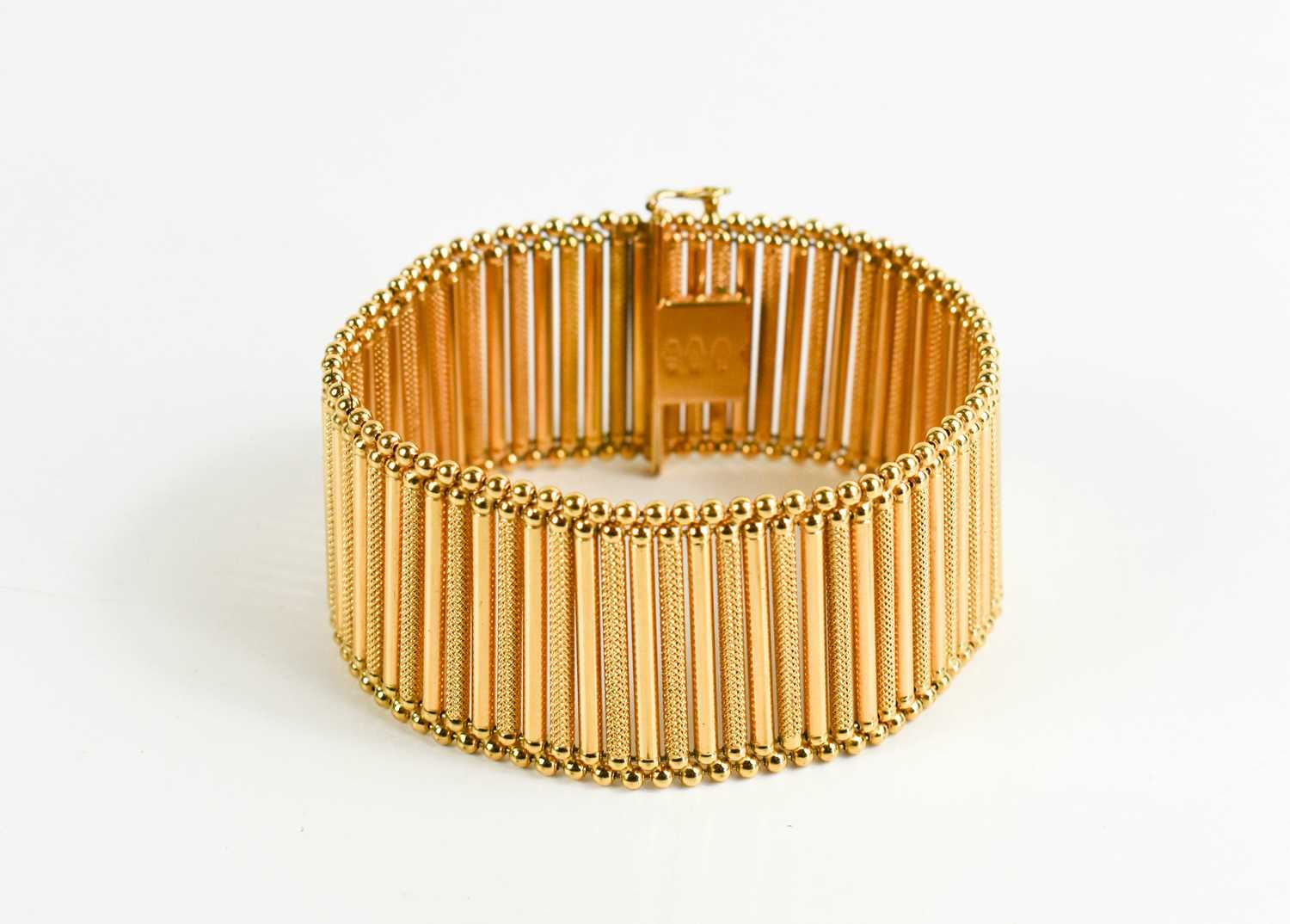 An 18ct gold bar link bracelet, plain links interspersed with machine engraved decoration, slide - Image 2 of 4