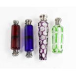Four Victorian glass scent bottles, including a cut glass example with amethyst coloured overlay,