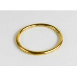 A 14ct gold bangle, with hinged clasp, 13.50g, internal measurements 52.6 by 60.4mm.