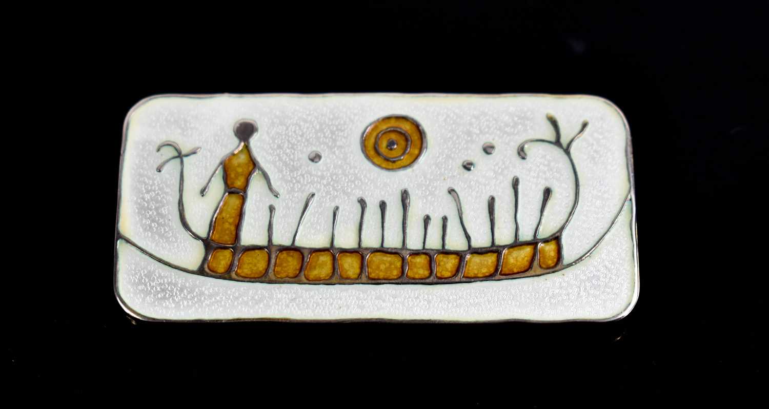 A David Andersen of Norway silver and enamel brooch, depicting figure in a boat 6½ by 3cm.