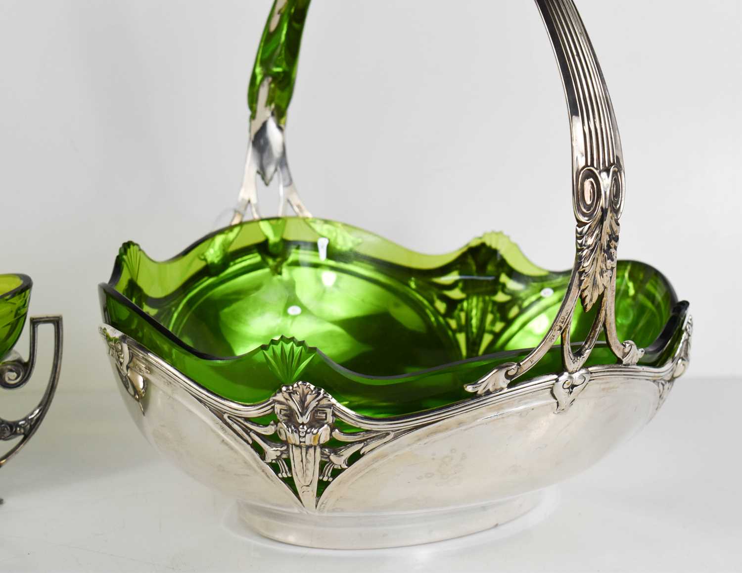 A WMF Art Nouveau fruit bowl, circa 1910, with green glass liner.