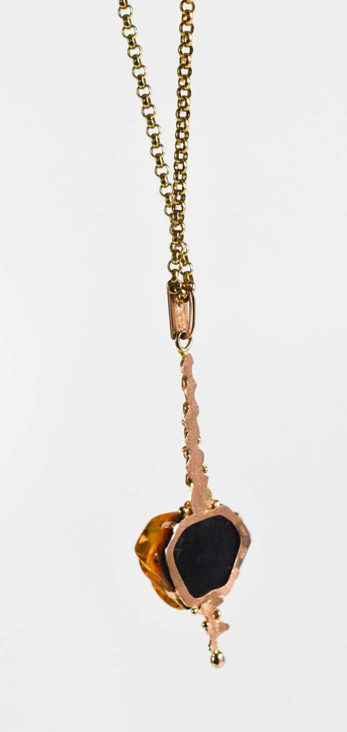 A 14ct rose gold and amber pendant, of contemporary design, on a 9ct gold chain link necklace, 7. - Image 4 of 4