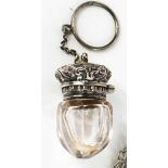 A Victorian acorn form vinaigrette, circa 1890, with clear glass bottle, white metal cover, and