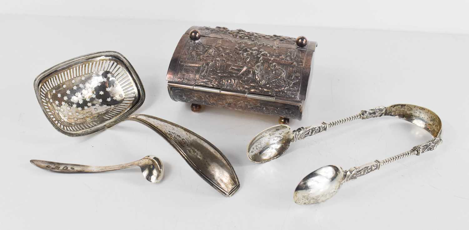 A group of Dutch silver to include a mustard spoon, sifter with star pierced bowl, sugar tongs,