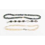 A moss agate and silver bracelet (one cabochon missing), together with a moss agate beaded necklace,