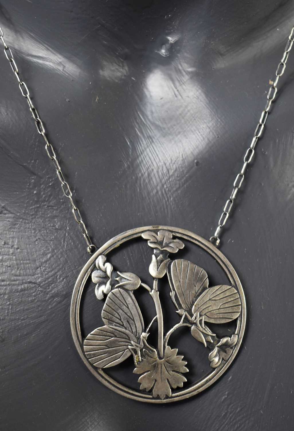 A Georg Jensen silver pendant necklace and matching brooch, both of circular form pierced to - Image 2 of 4