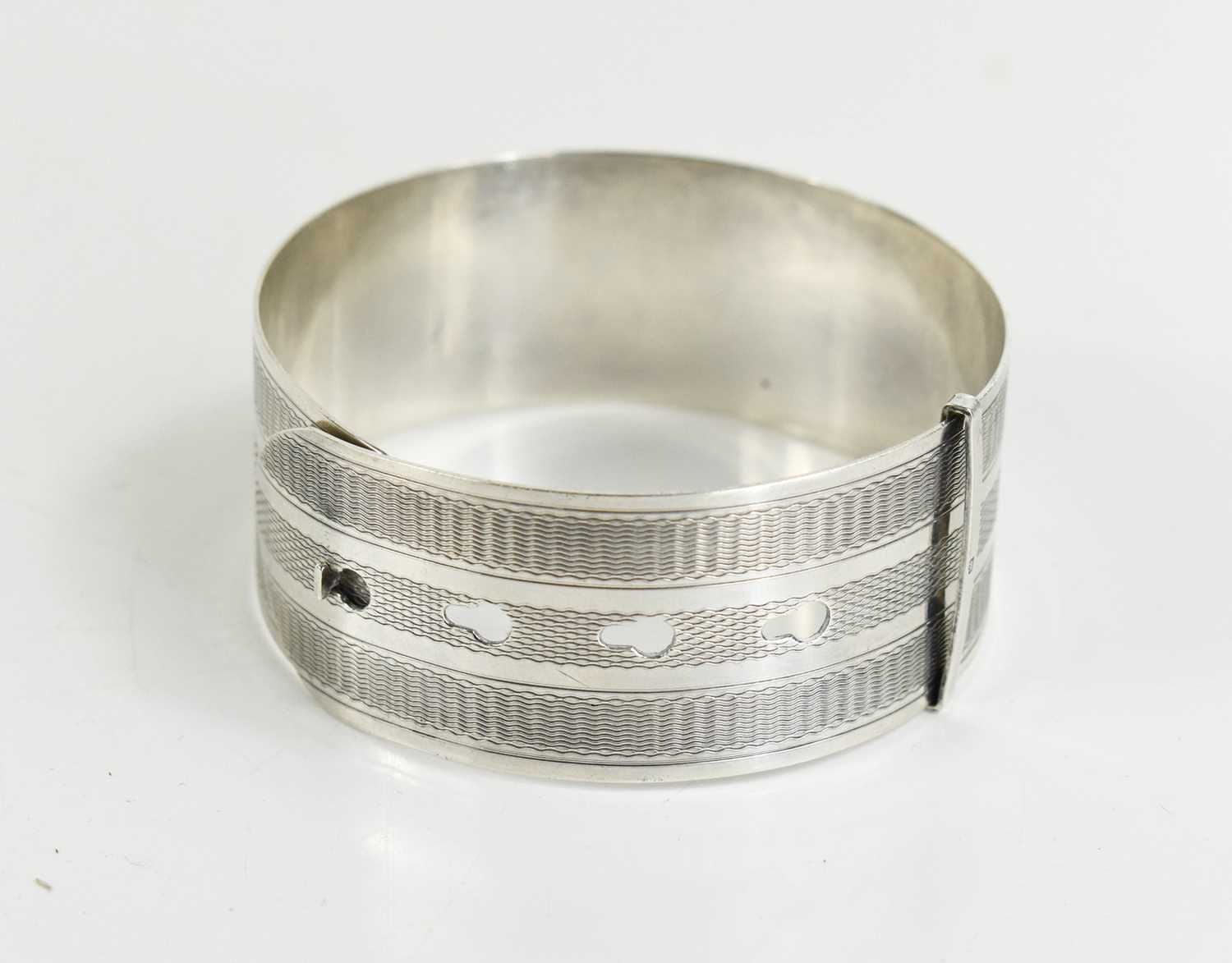 A Charles Horner silver bangle, engraved with machine engraved decoration, Chester 1945, 1.05toz. [