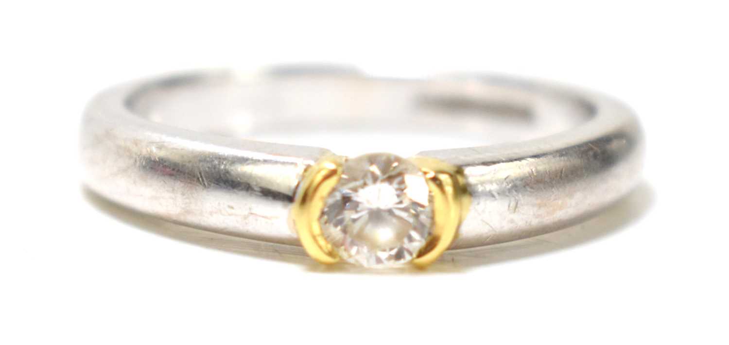 An 18ct white gold and diamond solitaire ring, the brilliant cut stone of approximately 0.2ct,