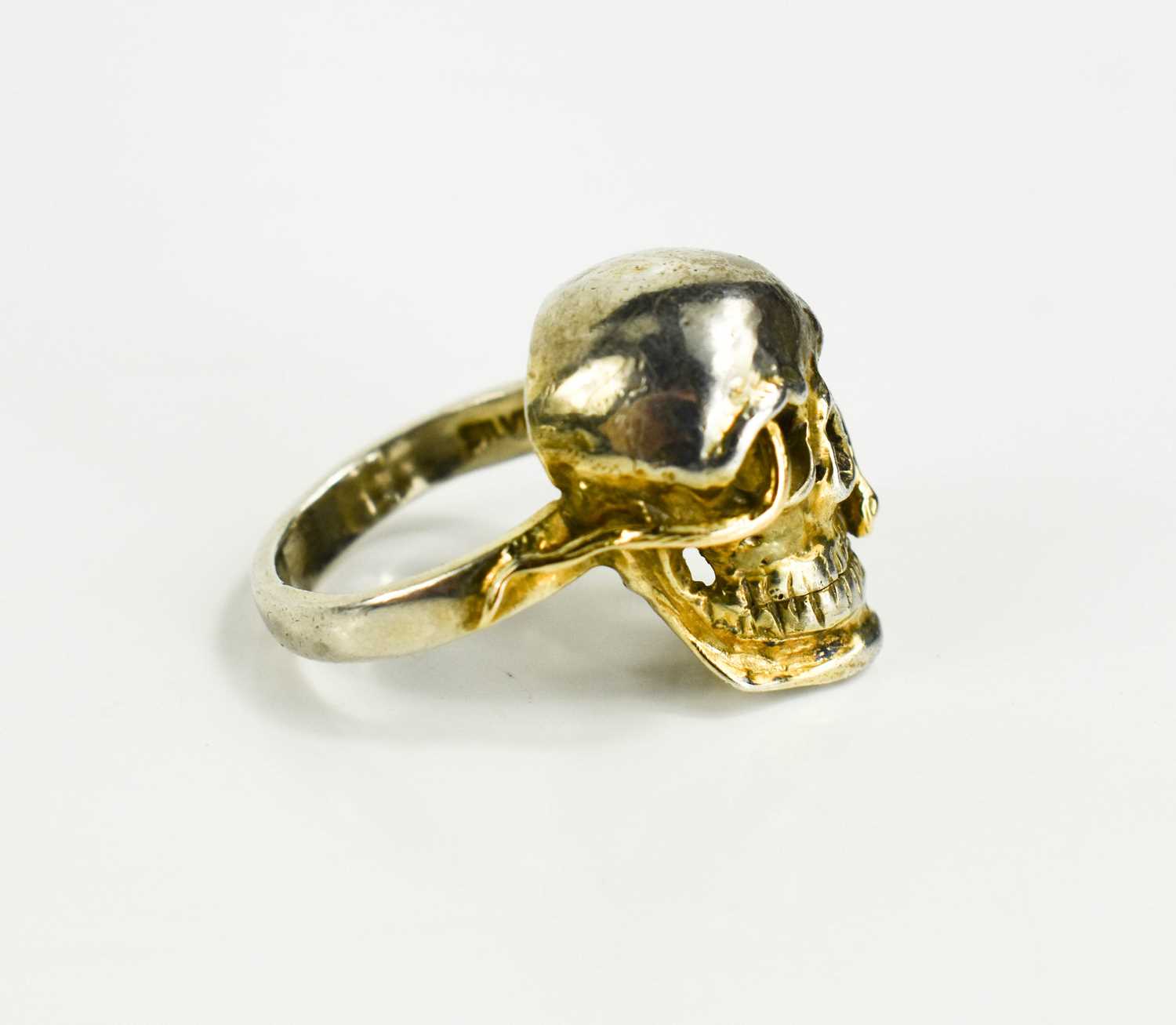 An unusual vintage silver gilt ring, finely modelled as a skull with a snake writhing through the - Image 2 of 2