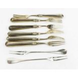 A set of six three pronged, 19th century Dutch 934 silver, herring forks, the filled handles with