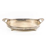 An Edwardian solid silver tray, of oval form, London 1901, with integral handles, pierced edge,