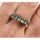 A 9ct white gold and prasiolite five stone ring, size S/T, 2.9g.
