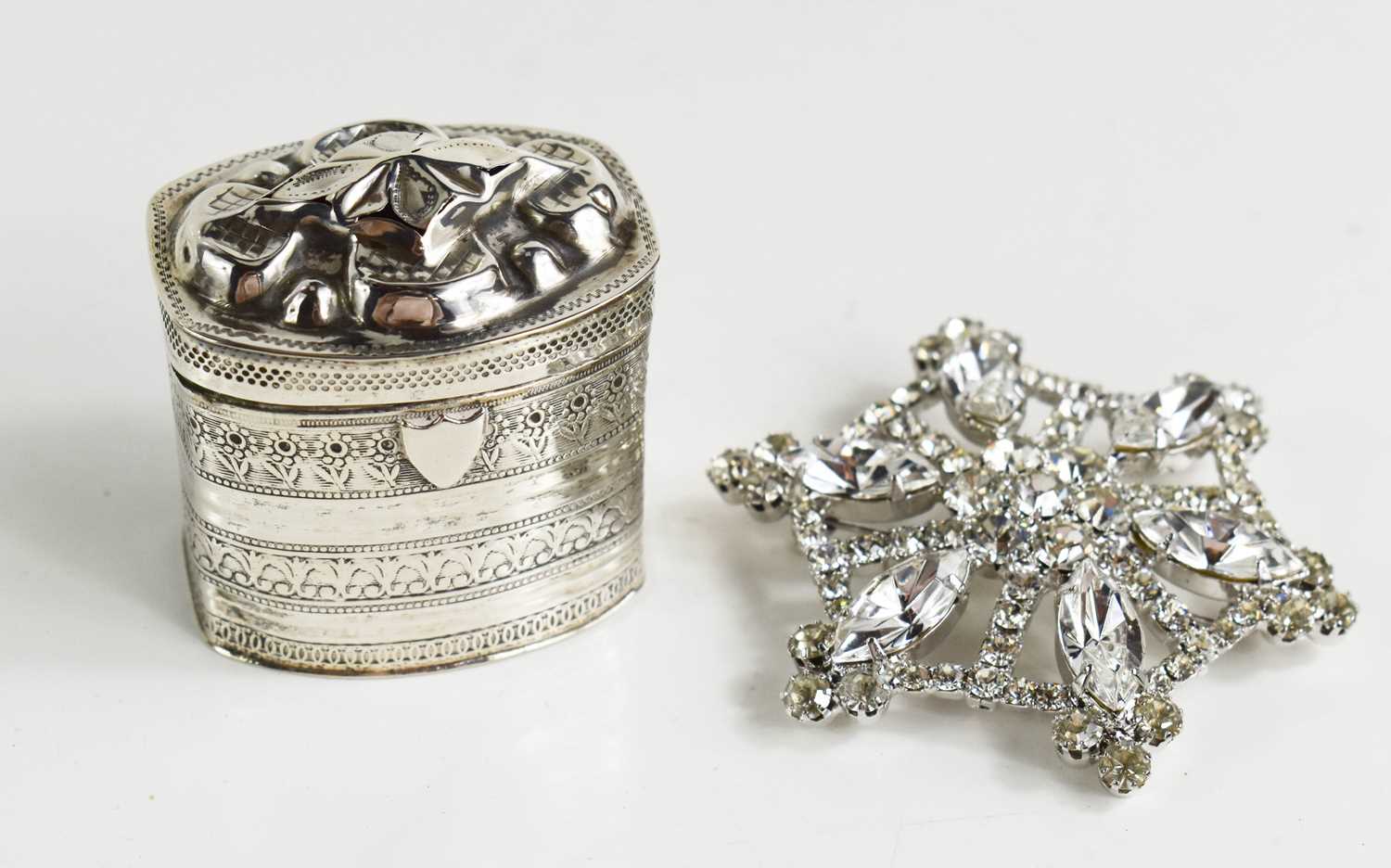 A Continental silver trinket box, possibly Dutch, together with a diamante brooch.