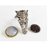 An Art Deco French dress clip set with paste stones, stamped Scemama, together with two Victorian