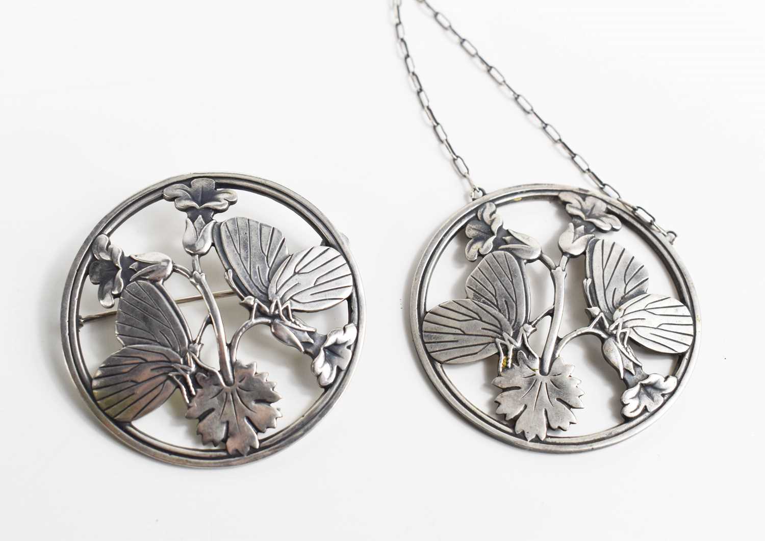 A Georg Jensen silver pendant necklace and matching brooch, both of circular form pierced to - Image 3 of 4