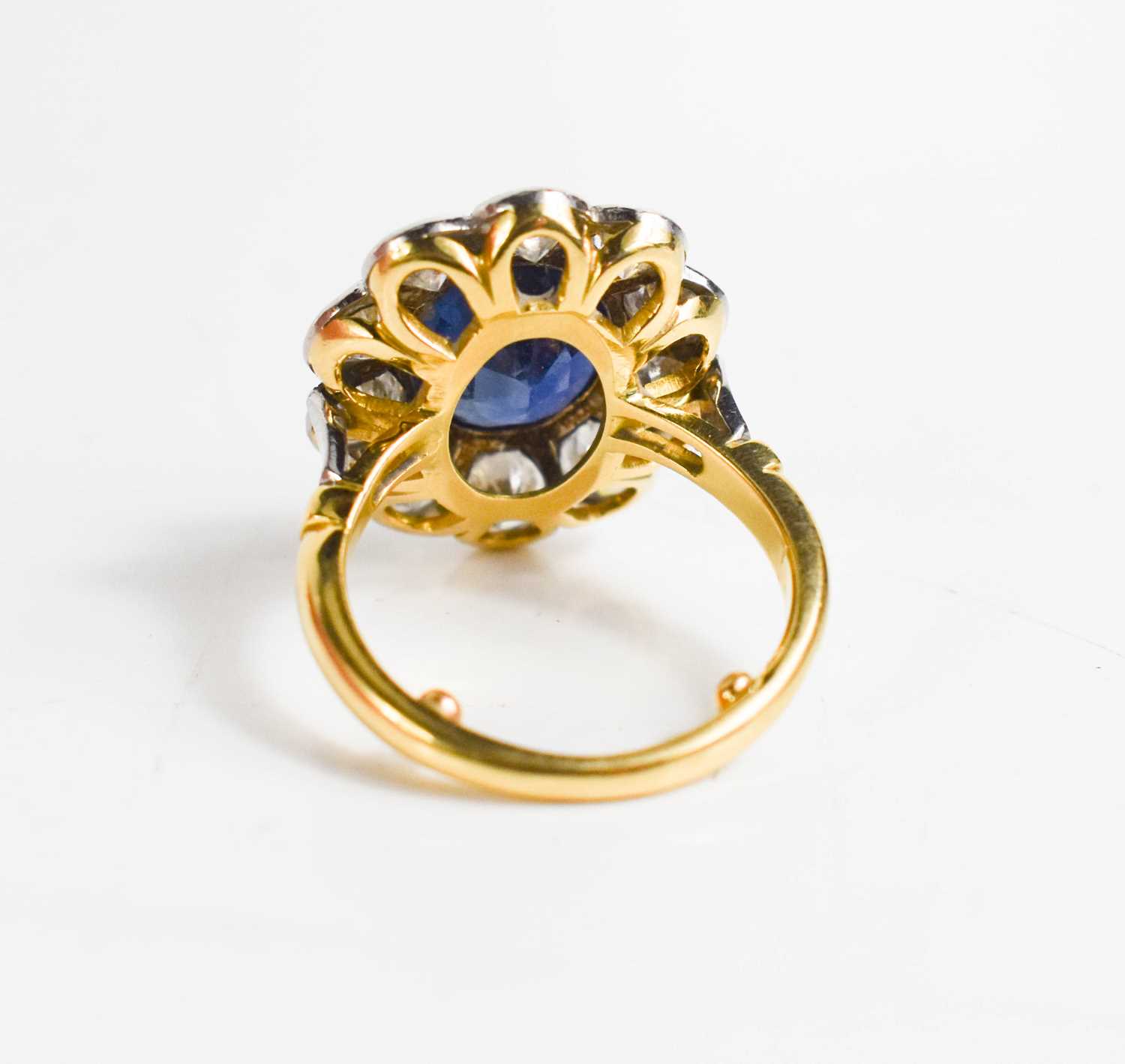 An 18ct yellow gold, sapphire and diamond ring, the central oval cut deep cornflower blue sapphire - Image 9 of 10