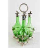 A Fenton Brothers silver plated and green glass decanter trio, the hand blown bottles having cork