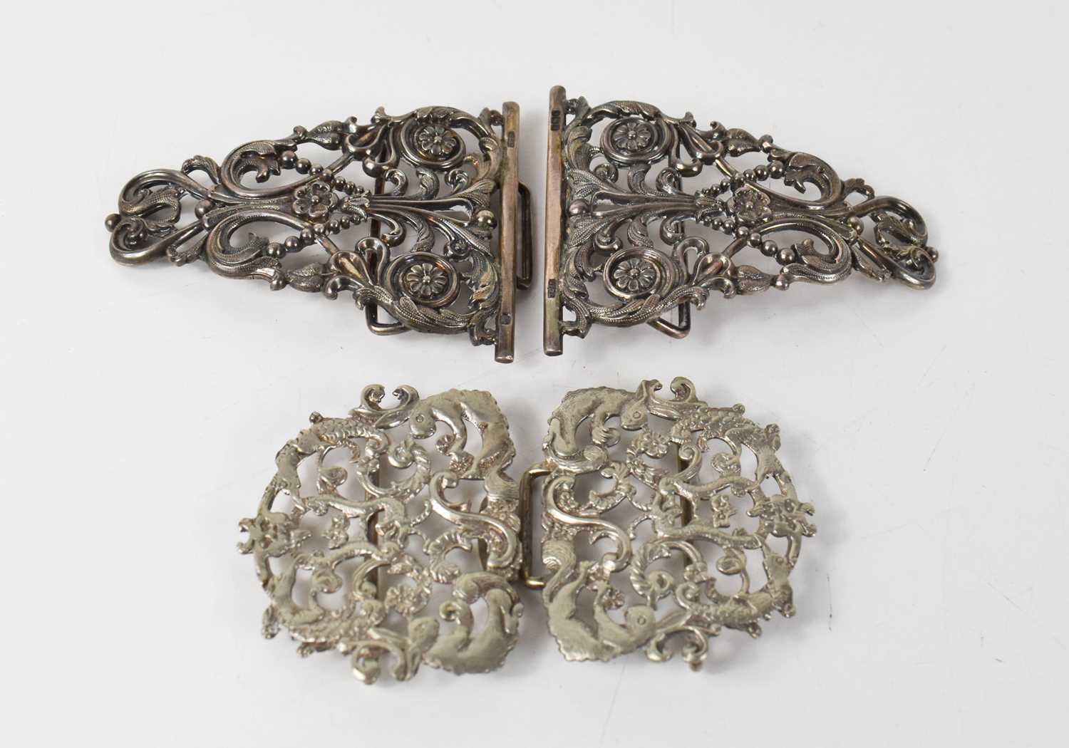 A Victorian silver nurse's belt buckle, of scrolling foliate form with flowers and beading