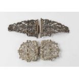 A Victorian silver nurse's belt buckle, of scrolling foliate form with flowers and beading