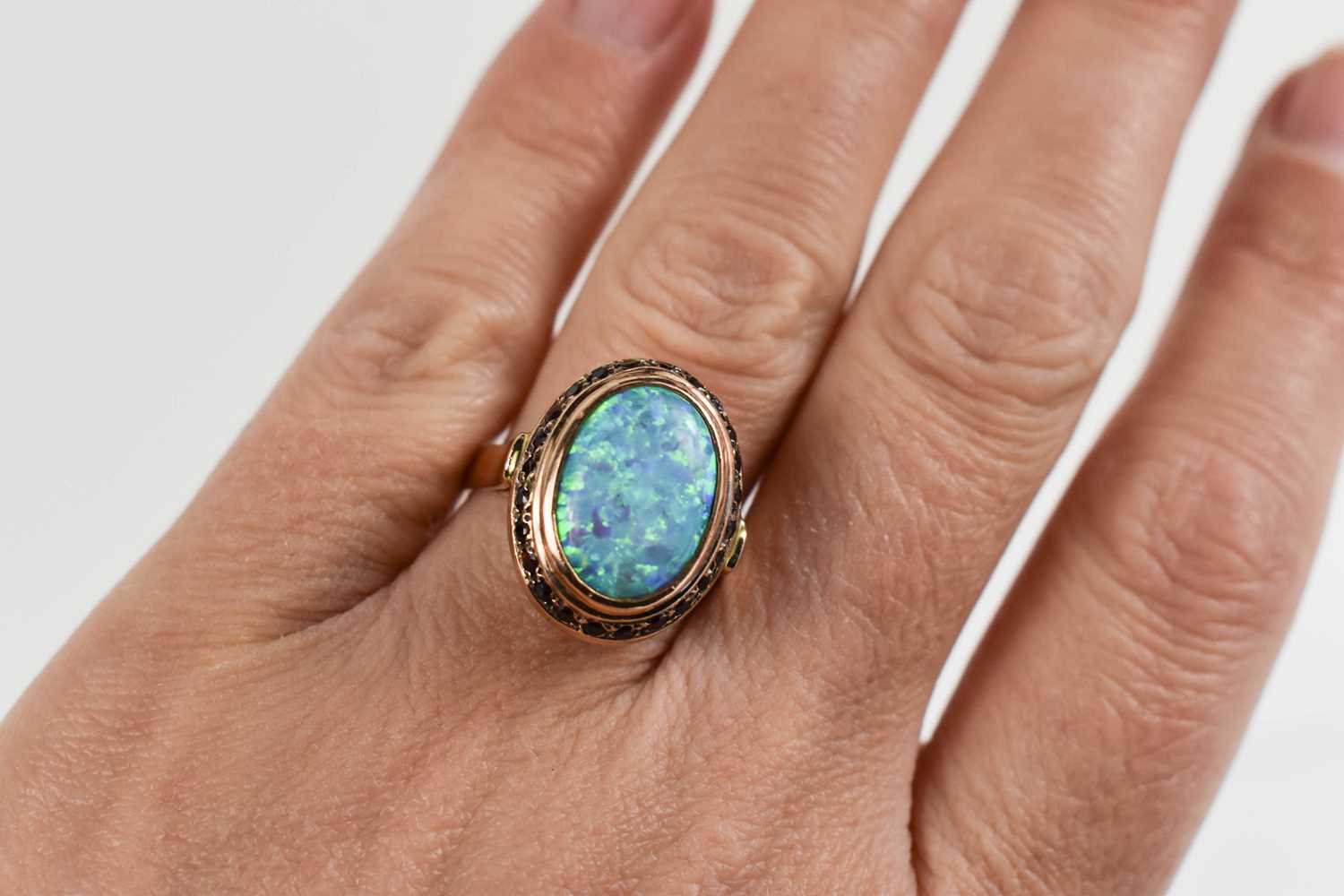 A 14ct gold, black opal and garnet ring, size O, 7.3g, and a pair of matching drops, set on base - Image 5 of 8
