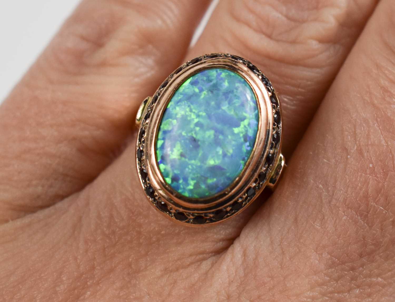 A 14ct gold, black opal and garnet ring, size O, 7.3g, and a pair of matching drops, set on base - Image 2 of 8