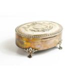 An Edwardian silver oval box, Birmingham 1906, the hinged lid decorated with bell flower swags, bows