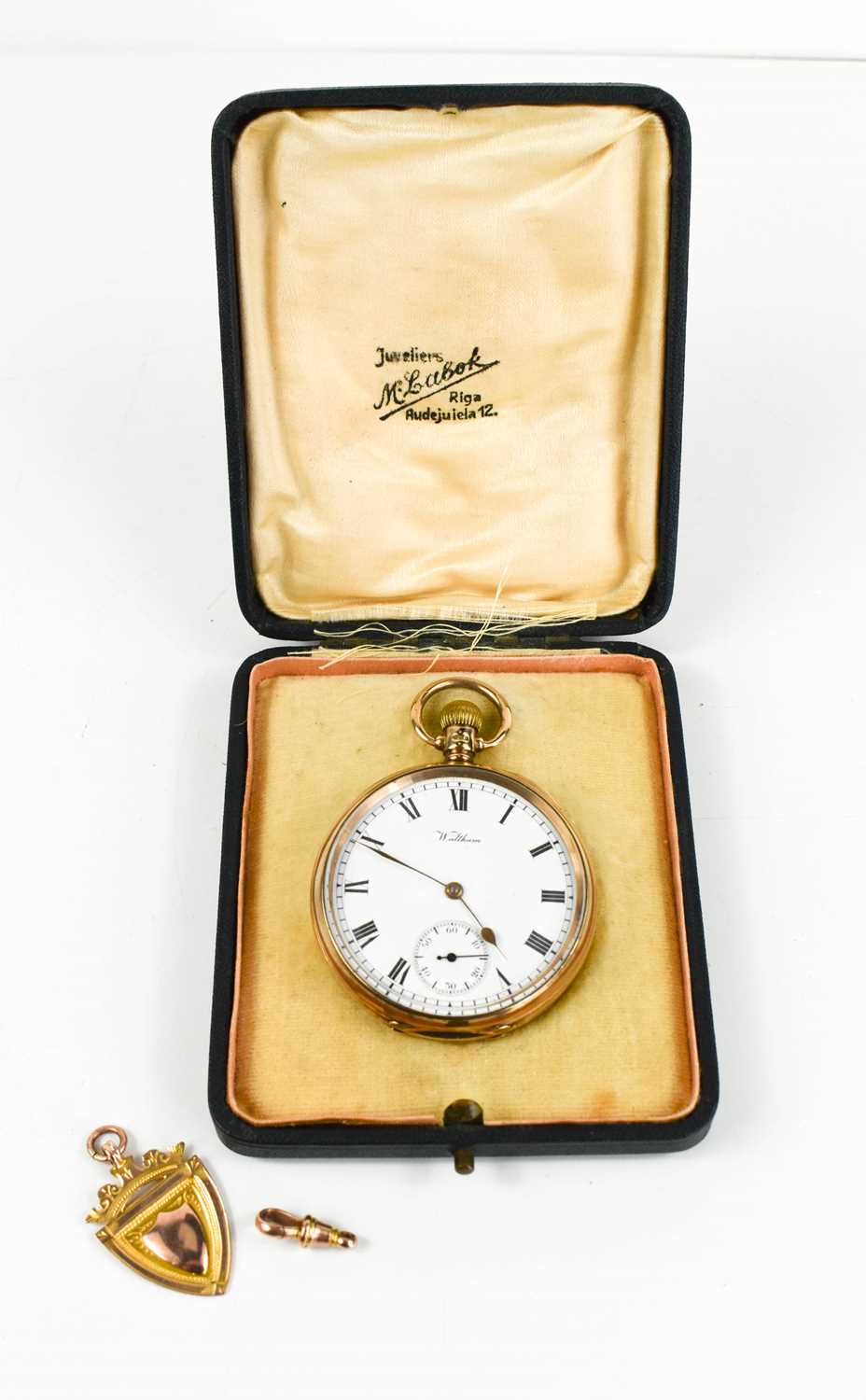 A 9ct gold open faced Waltham keyless wind pocket watch, with Roman numerals to the signed white