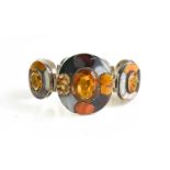 A Scottish silver, agate and orange Cairngorm stone set bracelet, composed of seven oval links, each