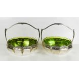 A pair of WMF Art Nouveau bowls, with green glass liners, Ostrich Hall mark, 23cm wide.