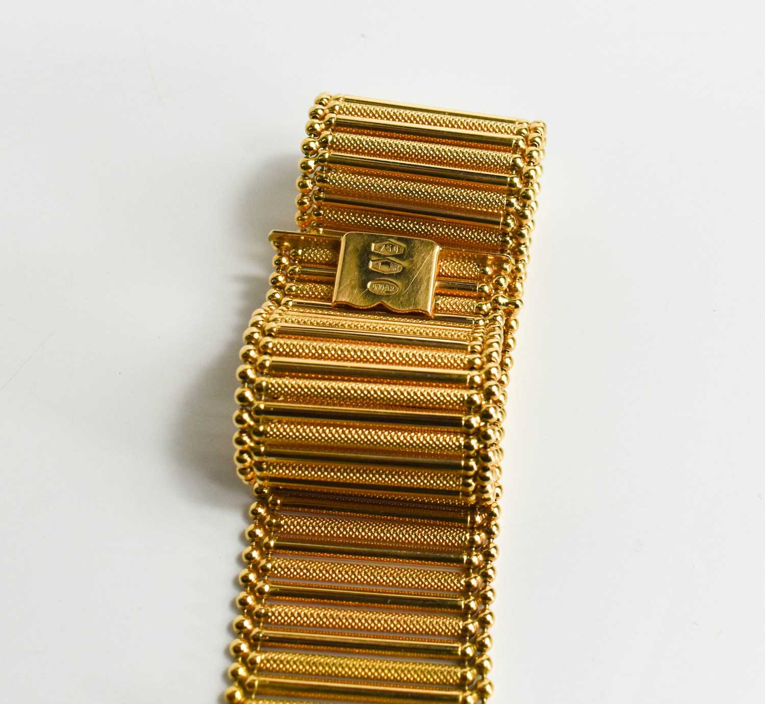 An 18ct gold bar link bracelet, plain links interspersed with machine engraved decoration, slide - Image 3 of 4