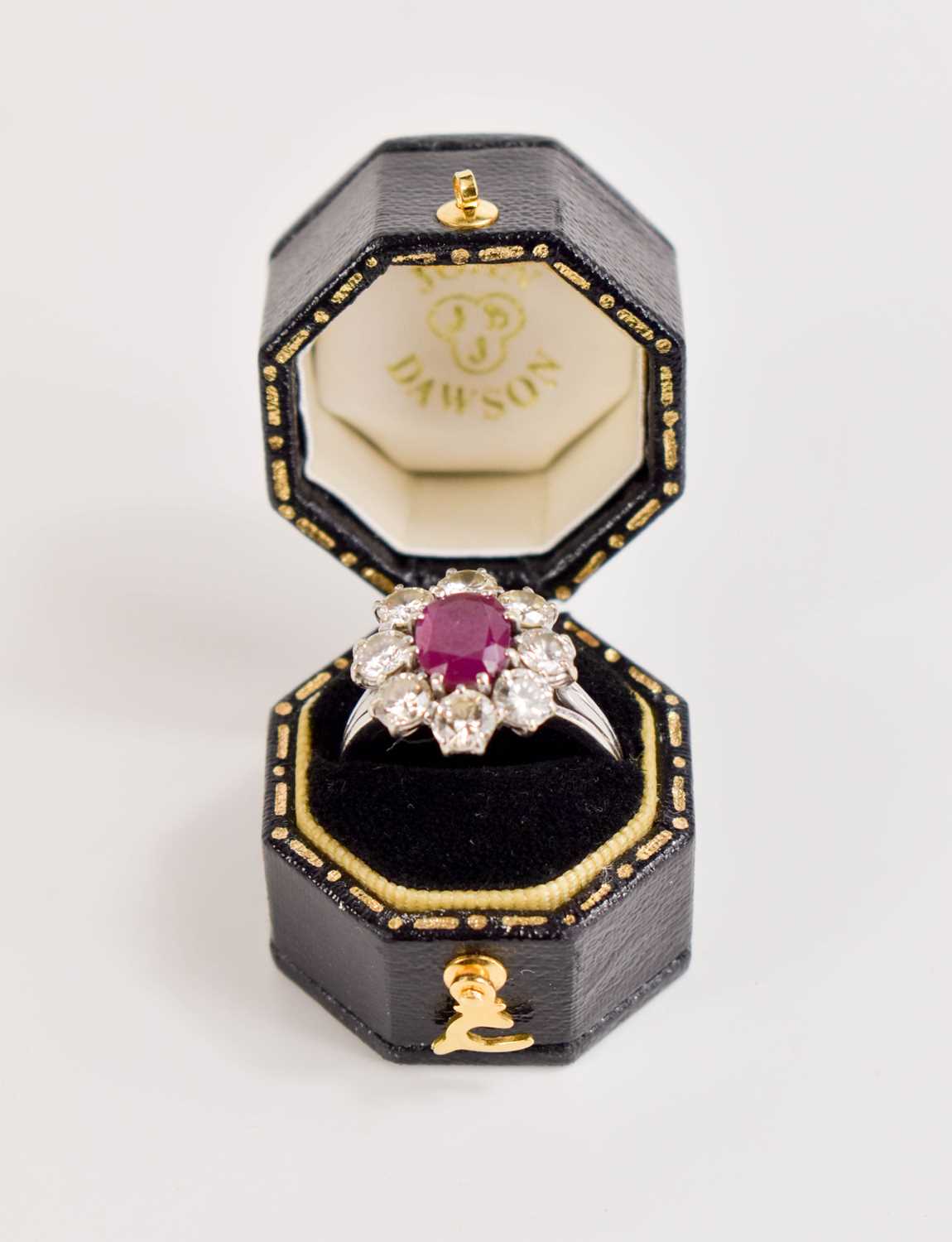 An 18ct white gold, (unmarked but tested as 18ct) ruby and diamond flowerhead ring, the central oval - Image 6 of 11