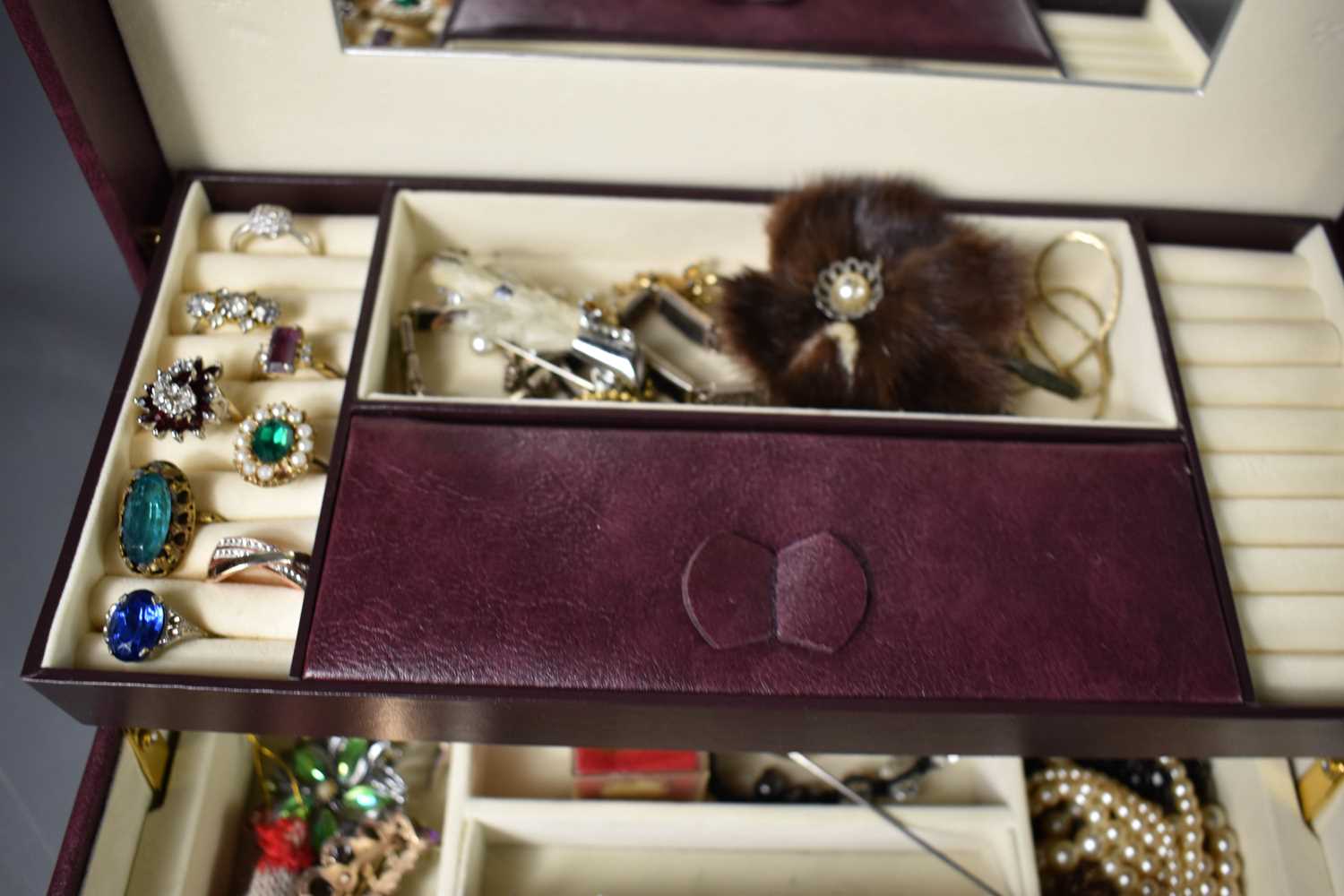 A jewellery box containing costume jewellery to include rings, charms, bracelets, Scottish grouse - Image 2 of 4