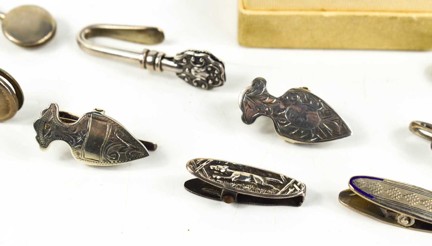 A collection of fourteen silver napkin clips and two silver clips, including one engraved with a - Image 2 of 2