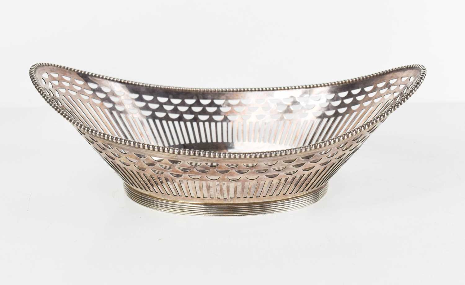 A Dutch silver basket dish of oval form, with pierced sides, beaded edge and reeded rim, 6.5toz.