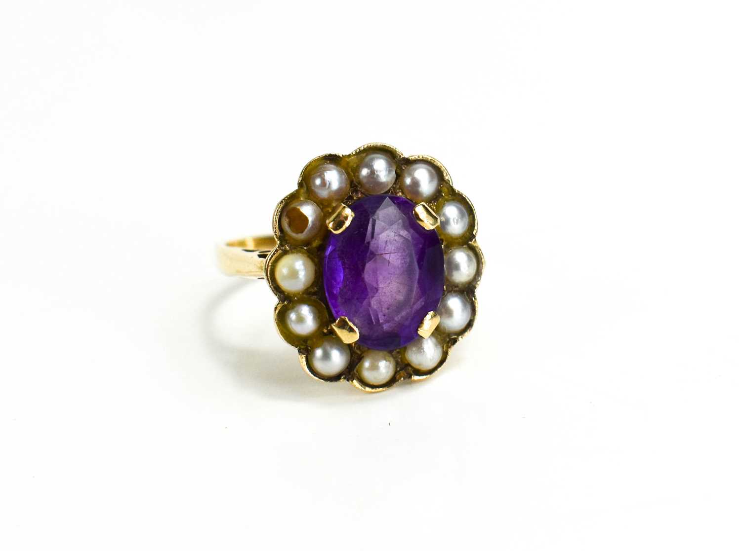 A 9ct gold, amethyst and seed pearl ring, the oval cut amethyst 10mm by 7mm, bordered by seed - Image 5 of 6