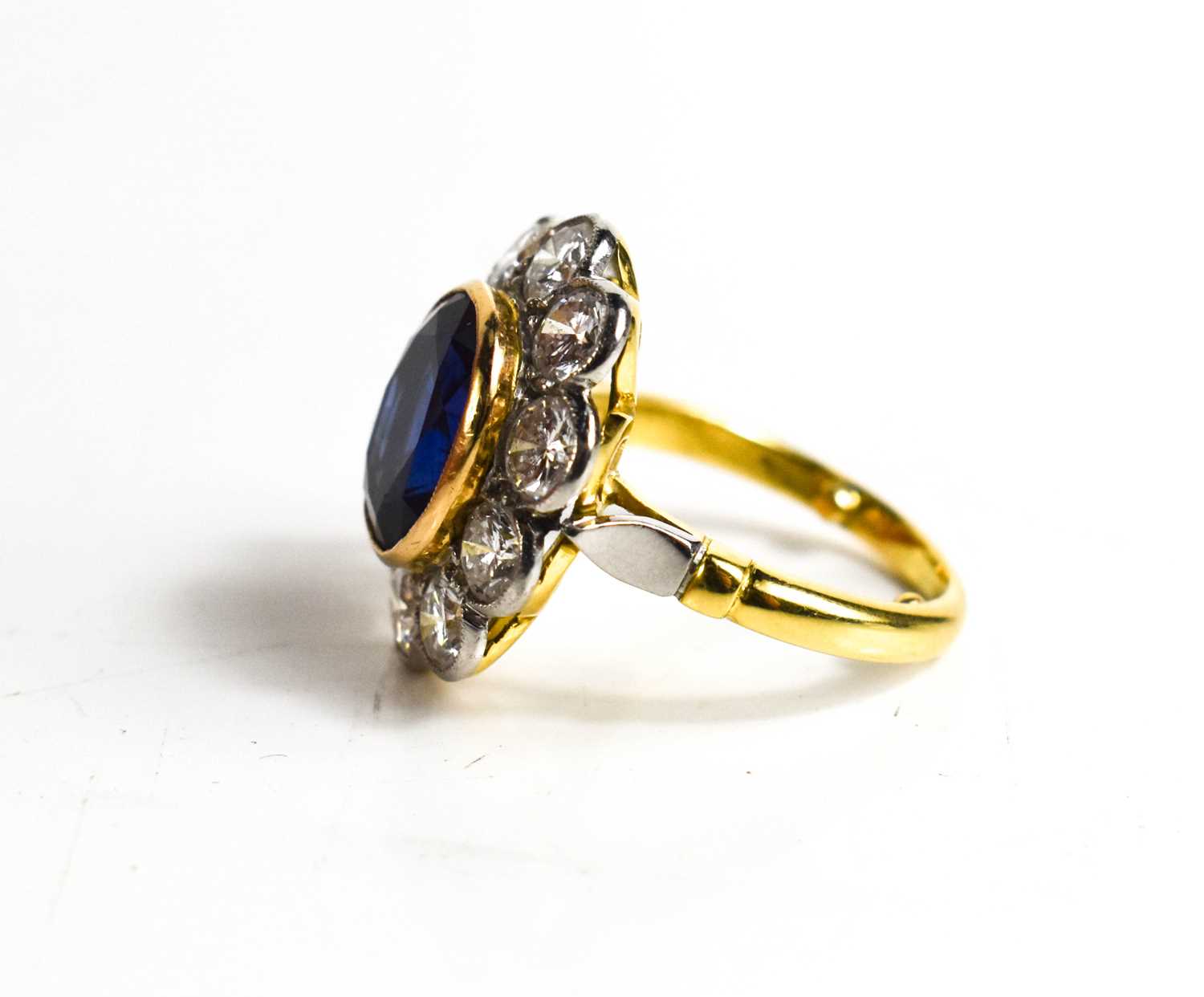 An 18ct yellow gold, sapphire and diamond ring, the central oval cut deep cornflower blue sapphire - Image 4 of 10