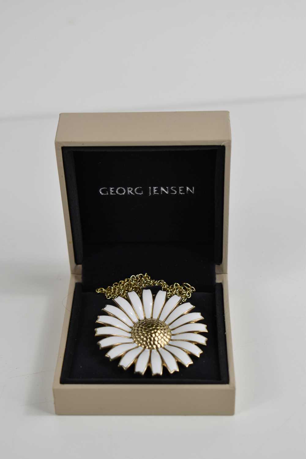A Georg Jensen Daisyhead gold plated silver and enamel pendant / brooch, with silver gilt