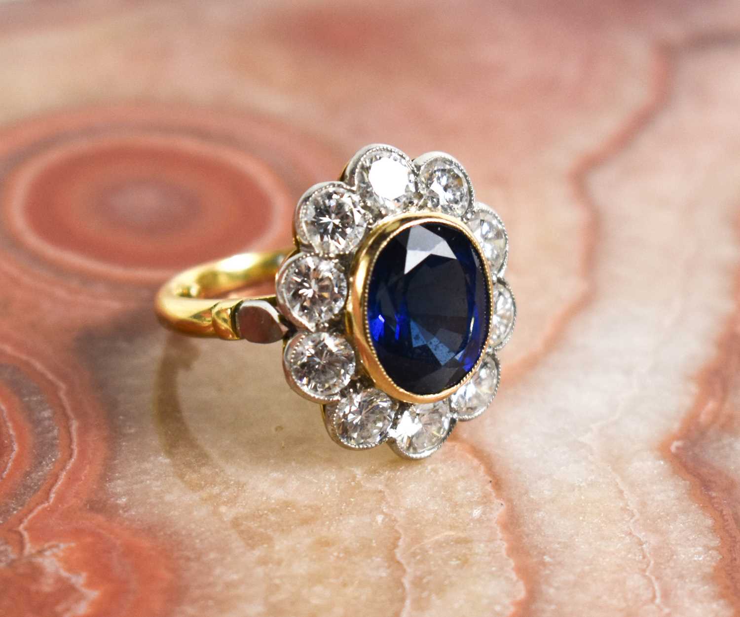 An 18ct yellow gold, sapphire and diamond ring, the central oval cut deep cornflower blue sapphire - Image 5 of 10