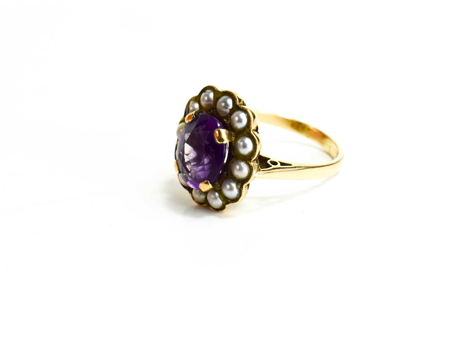 A 9ct gold, amethyst and seed pearl ring, the oval cut amethyst 10mm by 7mm, bordered by seed - Image 6 of 6