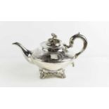 A fine Georgian silver teapot, London 1843, the cover having a flower form finial, engraved with