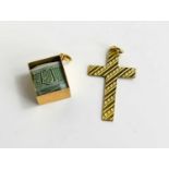 A 9ct gold cross and charm with a £1 note within, 3.48g.