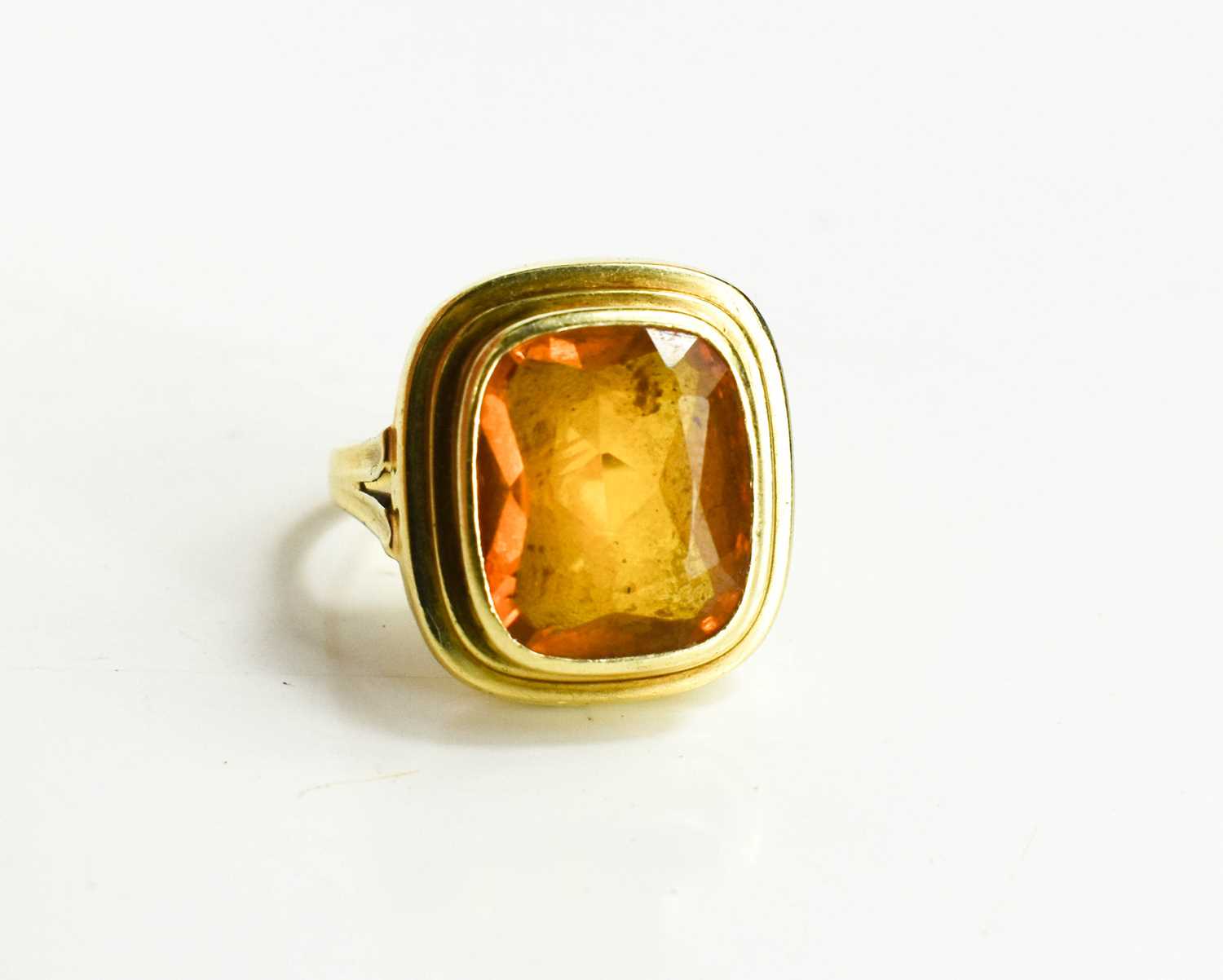 A 15ct gold and citrine ring,the rectangular cut citrine measures 8 by 5mm, size N, 5.5g.