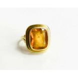 A 15ct gold and citrine ring,the rectangular cut citrine measures 8 by 5mm, size N, 5.5g.