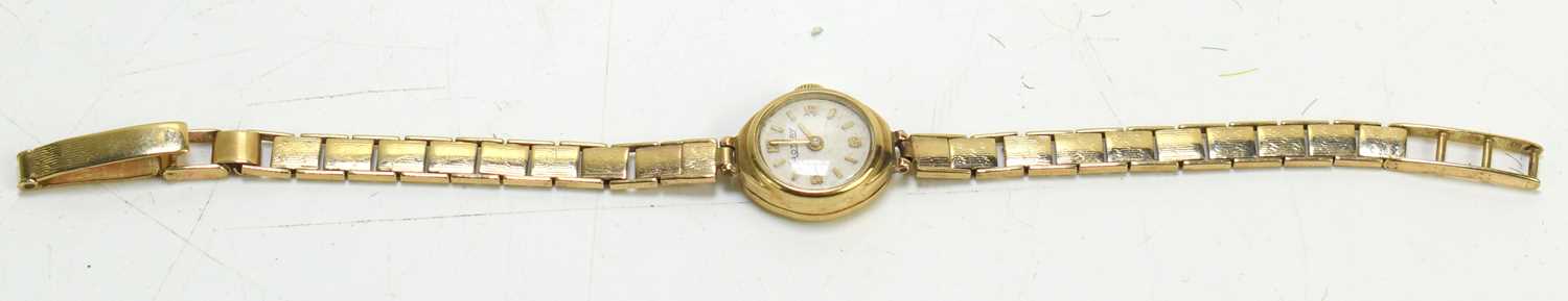 A lady's 9ct gold cased wristwatch with 9ct gold bracelet strap, the face with quarter Arabic